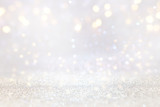 Fototapeta Natura - abstract background of glitter vintage lights . silver, gold and white. de-focused