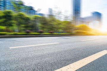 city empty traffic road with cityscape in background