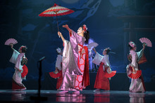 Traditional Japanese Performance. Actresses In Traditional White And Red Kimono And Fox Masks Dancing With Umbrella And Fans.