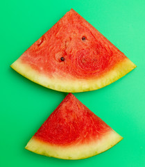 Canvas Print - Ripe red watermelon isolated on a green background