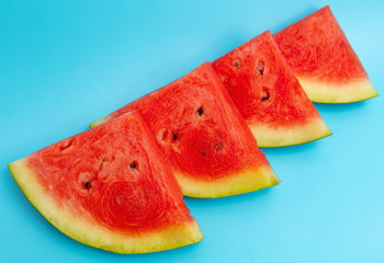 Canvas Print - Ripe red watermelon isolated on a blue background