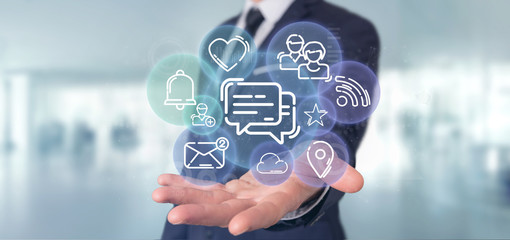 Businessman holding a cloud of social media network icon