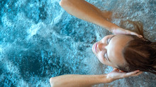 Close Up Of An Young Female Is Enjoying And Having Relax In A Whirlpool Bath Tube In A Luxury Wellness Center.