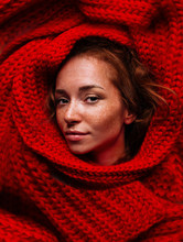 Redhead Woman Portrait With Freckles. Portrait Of Woman In Knitted Red Scarf