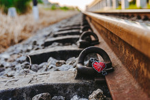 The Red Heart Rests On Old Iron Train Tracks.