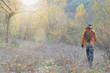 fly fisherman in the wild in autumn