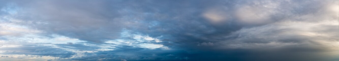 fantastic clouds against blue sky, panorama