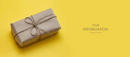 Wall Mural - Parcel wrapped in craft paper and tie thread. Gift box. Online shopping. Yellow background. Web article template. Long header banner format. Sale coupon. Visit card. Your information. Text space.