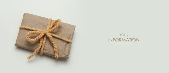 Wall Mural - Small parcel wrapped in craft paper and tie yellow thread. Light gray background. Web article template. Long header banner format. Sale coupon. Visit card. Your information. Text space.