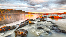 Dramatic Sunset View Of Fantastic Waterfall And Cascades Of Selfoss Waterfall.