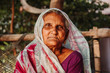 Closeup portrait of an old Indian woman wearing saree