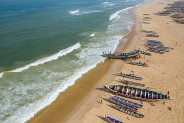 Poster - Aerial view of fishing village, pirogues fishing boats in Kayar, Senegal.  Photo made by drone from above. Africa Landscapes.