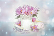 spring blossom on pastel background with blurry lights. romantic floral composition with pink crocus flowers and delicate arrangement