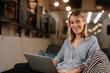 © JustLife - Girl on her laptop at home. Woman using her laptop while lying down. Young female works from home.