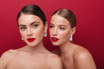 Wall Mural - Beautiful young two women with bright red lipstick