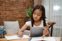 Portrait Of Young Teenager Junior High School Student Studying At Home