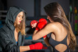 © jovannig - Two beautiful female boxer in the gym at night preparing for a fight