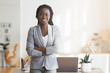 © Prostock-studio - Successful Afro Businesswoman Posing In Office With Arms Crossed