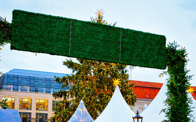 Sticker - Sign board Decoration at entrance into Christmas Market at Gendarmenmarkt square in Winter Berlin, Germany. Name plate at Advent Fair and Stalls with Crafts on Bazaar. German street Xmas and holiday