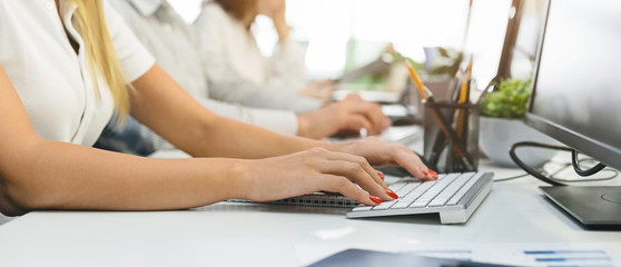 Poster - Female hands typing on computer keyboard at workplace