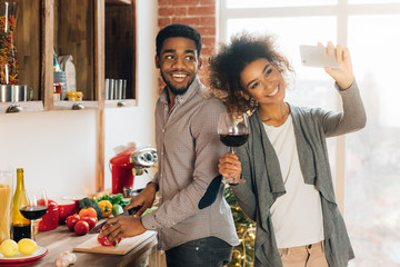 Young millennial couple shooting home video about food