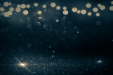 Wall Mural - blue abstract glitter bokeh on black background