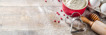 Valentine Day Baking Background. Ingredients For Cooking Valentine's Heart Cookies. Flour, Eggs, Sugar, Spices On Wooden Background With Red Flower Roses. Top View Copy Space.
