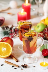 Canvas Print - hot winter drink Cranberry Apple Cider Punch. Garnish with apples, oranges, and cranberries. hot apple cider with spices on a festive table on Christmas or New Year.