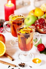 Canvas Print - hot winter drink Cranberry Apple Cider Punch. Garnish with apples, oranges, and cranberries. hot apple cider with spices on a festive table on Christmas or New Year.