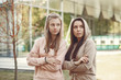 © hetmanstock2 - Women in a autumn park. Girl in a brown suits. Friends have fun
