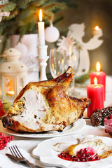 Poster - Christmas turkey with cranberry sauce on the holiday table and candles