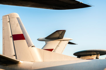 Wall Mural - background wings of a large soviet airliner against a blue sky isolated