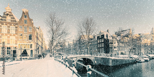 Winter snow view of a Dutch canal in Amsterdam Wallpaper Mural