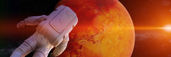 Wall Mural - astronaut watching the sunrise during a space walk in orbit of planet mars (3d science render banner