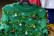 Beautiful or ugly: green Christmas sweater with decor balls