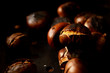 closeup of roasted chestnuts in a pan 