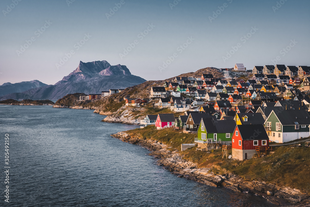 Nuuk capital of Greenland with Beautiful small colorful houses in myggedalen during Sunset Sunrise Midnight Sun. Sermitsiaq Mountain in Background. Blue and pink Sky. - obrazy, fototapety, plakaty 