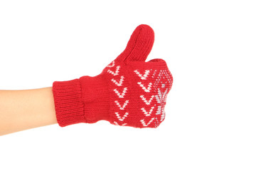 Sticker - Hand in knitted mitten showing thumb up on white background