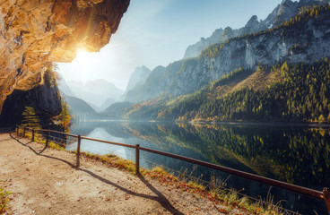 Fotobehang - Wonderful Sunny Landscape at Vorderer Gosausee lake in Austrian Alps. Awesome alpine highlands at sunset. Fairy autumn scene in Alpine highland.  Picturesque view of nature. amazing natural Background