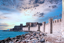 Ruins Of Medieval Castle Or Fortress At Sunset. The Fortress Name Is Anamur Castle In Mersin Town, Turkey