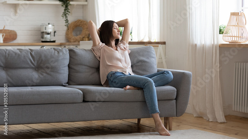 Cuadros en Lienzo Serene lady lounge on sofa feel fatigue napping at home