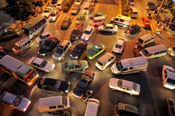 messy traffic at crossroad at night, aerial view