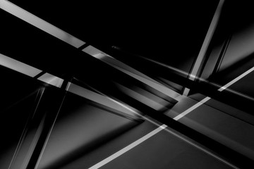 Poster - Fragment of modern architecture / interior with glowing lines in darkness. Abstract black geometric background with luminous angular / triangular structure in grunge style.