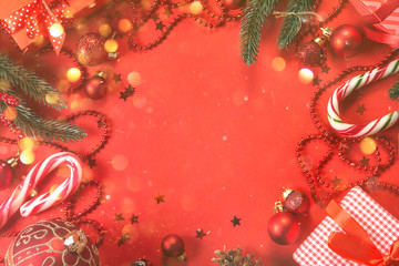 Sticker - Christmas decorations on red background, top view