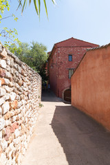 typical alley ocher Roussillon village in France