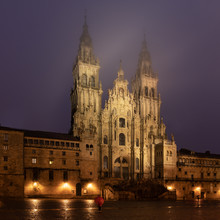 Santiago De Compostela Cathedral View At Misty Foggy Night After Rain. Cathedral Of Saint James Pilgrimage. Galicia, Spain