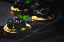 Homemade Small Cake With Blackberry And Delicious Cream Of Vanilla And Mint On Dark Background