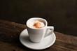 © Ramon Lopez/ADDICTIVE STOCK - From above delicious fragrant brown beverage with white foam in ceramic cup on wooden table