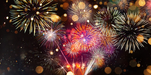 Wall Mural - Colorful firework with bokeh background. New Year celebration.