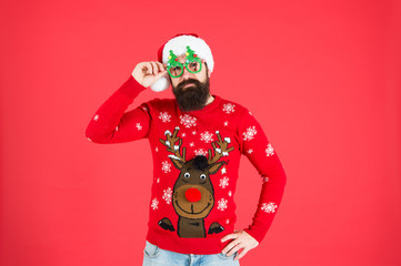 Wall Mural - santa man party glasses. man santa hat red background. merry christmas. hipster man reindeer on knitted sweater. winter holiday. cold season clothes. happy new year. red is christmas color